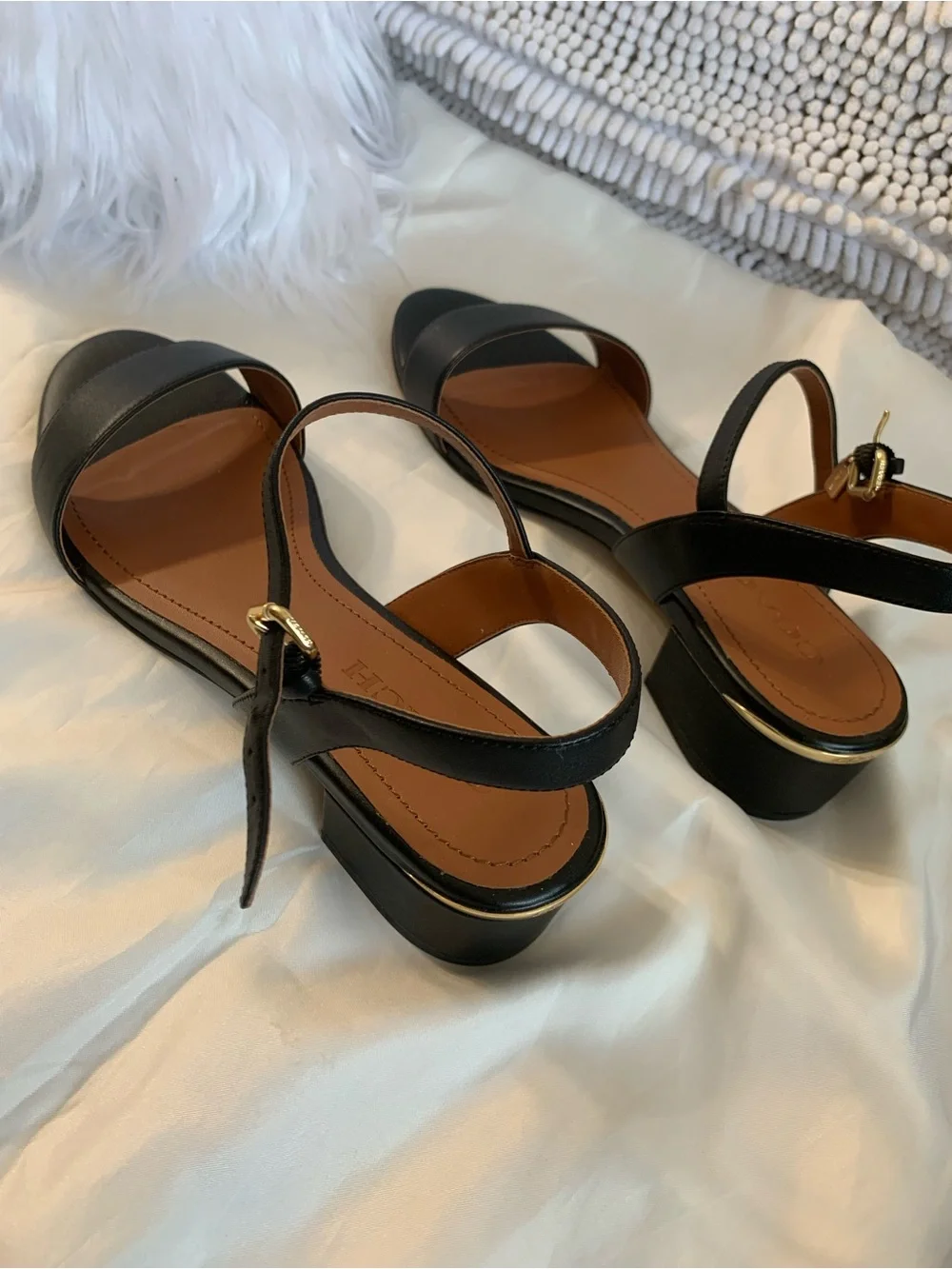NWOT. Coach smooth leather, black sandals. Gold hardware.
